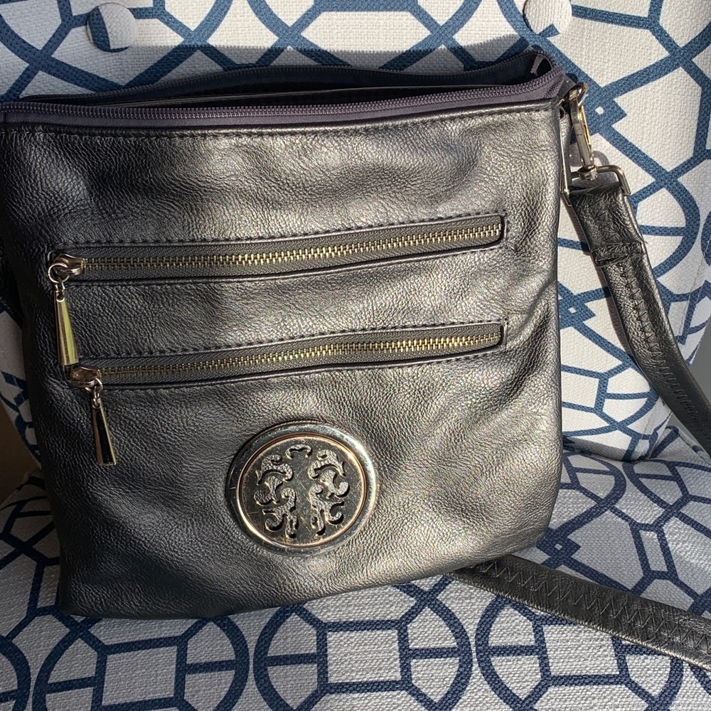 Dark silver cross body.